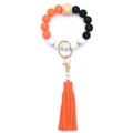 Close-up of silicone bead keychain bracelet with marble patterns and orange leather tassel - Style 31 (Orange Black Marble)