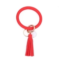 Detail of red pebbled PU leather bracelet keychain with tassel and gold spring clasp - Red