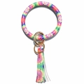 Macro detail of rainbow tie-dye leather wristlet keychain with golden ring and tassel fringe - Solid Red Tie-dye