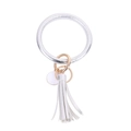 Detail view of silver PU leather ring keychain with gold clasp and matching tassel - Silver