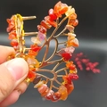Detail of handmade gold butterfly hair claw with natural orange and yellow crystal stones - Red Agate Gold Butterfly
