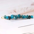 Detail of blue natural crystal stone hair clip with elegant golden metal base - Blue Apatite + Gold Clip