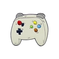 Macro di una spilla smaltata bianca a forma di controller retrò con pulsanti colorati - Controller di Gioco Bianco
