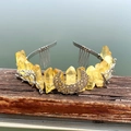 Detailed view of yellow crystal crown with silver crescent moon and branch hair comb - Yellow