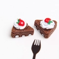 Macro view of miniature chocolate cake slice with strawberry and cream detail - Coffee Apple Cake