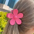 Pink matte floral hair claw clip for women styled on long brown hair in outdoor setting - 7.2*7.2*4.1 / Rose Red
