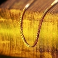 Close-up of minimalist golden titanium steel box chain necklace with smooth finish - Box Chain / Elegant Gold