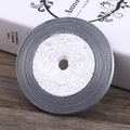 Roll of 6mm grey elastic ribbon on white spool for sewing and gift wrapping crafts - Gray