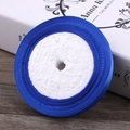 Deep blue satin ribbon roll on foam core, ideal for elegant gift wrapping and DIY crafts - Sapphire Blue