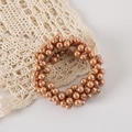 Detail of elegant pearl hair tie with gold elastic band on lace fabric background - OPP Bag / Champagne