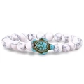 Detail of beaded bracelet with white turquoise stones and green sea turtle charm - White Turquoise