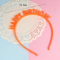 Macro view of orange Happy Birthday party headband showing the 14.5cm diameter measurement - Orange