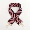 Detail of pink and black zebra pattern woven shoulder strap with gold swivel hooks - Deep Pink Zebra Print / Gold Buckle