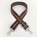 Close-up of adjustable brown nylon bag strap with white arrow pattern and silver hardware - Coffee Silver Thread + Silver Buckle