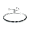 Macro shot of adjustable sliding clasp on tennis bracelet with black square-cut zircons - White Gold + 2.5mm Round Black Stone