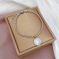 Détail du bracelet en perles d'acier inoxydable argenté avec pendentif étoile sur boîte - Style Coquillage Blanc Argenté (K312)