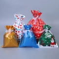 Christmas drawstring gift bags in gold, red, and blue with festive patterns and ribbon ties - Set of 30 in 5 Styles