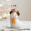 Vista detallada de figurita de ángel en resina pintada a mano con estrella de 11cm - Estilo C Estrella Pequeña