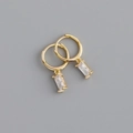 Detail of gold ear hoops featuring rectangular clear zircon charms on a gray backdrop - Rectangular White Rhinestone Earrings (S-E1534) / Gold