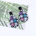 Waterdrop-shaped acrylic earrings featuring colorful snowflake patterns on a black base - Snowflake