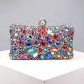 Close-up of vibrant multi-colored rhinestones and pearl clasp on luxury metal evening bag - Colorful Silver