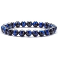Macro shot of blue tiger eye stone beads on a stretch bracelet with glossy texture - Blue Tiger Eye