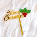 Detail of golden acrylic Merry Christmas cake topper with green holly leaves and red berries - Christmas Leaf Merry Christmas