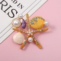 Spilla stella marina con perle e strass su un delicato sfondo rosa - Arancione