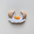 3D resin fridge magnet featuring a realistic broken egg design with yolk and shell - Cracked Flowing Egg