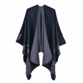 Detail showing the reversible knitted poncho with grey floral patterns on dark blue fabric - 135x155cm / Double-Sided Large Floral Black Grey