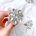 Sparkling crystal flower ring stand in silver finish held by hand against a white backdrop - Gem Holder-No.10 Big Flower-White
