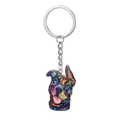 Détail du pendentif chien pop art coloré avec motifs vifs sur un porte-clés en métal - Motif de Chien Heureux