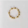 Detail der drehbaren goldenen Perlen auf einem Anti-Angst-Ring aus Edelstahl - US 5 / Gold (Edelstahl)