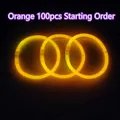 Luminous orange chemical glow stick bracelet for concerts and parties on black background - Orange