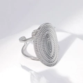Adjustable silver punk ring with textured oval face and concentric dotted pattern design - US 7 / Oval Textured Pattern (JR104) / Steel