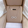 Silver infinity bow necklace with micro-diamonds in a beige luxury jewelry gift box - Titanium Steel / Silver