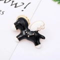 Macro detail of a black and white Pegasus enamel pin with gold metal outlines - 10# Black White Pegasus