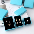 Sky blue jewelry gift set featuring bee necklace and pearl earrings in elegant boxes - Sky Blue