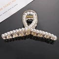 Elegant champagne acrylic hair claw clip with white pearls on a reflective black background - 1# Transparent Cross Pearl Hair Claw