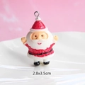 Macro shot of resin Santa Claus pendant for DIY crafts, measures 2.8x3.5cm - Style 33-Full Body Cartoon Santa