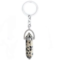 Detail of natural beige spotted stone hexagonal pendant with silver metal keychain - Dalmatian Jasper