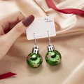 Festive Christmas ball drop earrings in green with gold stars on white card display - Green Gold Star Style
