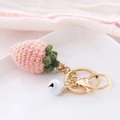 Handmade strawberry crochet keychain in pink yarn with small bell and golden hardware - Fruit Style-Strawberry