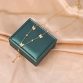 Elegant gold butterfly tassel necklace with sparkling zircon crystals on a satin background - Gold