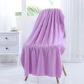 Thick purple coral fleece bath towel draped on a chair showing soft plush texture - 70*140cm / Purple
