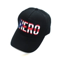 Macro view of black baseball cap with HERO letter print and flag texture details - BORN TO BE HERO US Flag