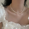 Close-up of elegant freshwater pearl necklace worn on collarbone with white lace top - Style 4 Freshwater Pearl
