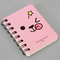 Detail of pink A7 spiral notebook featuring a cute cartoon animal and quote on the cover - Expression-Pink