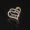 Detail of golden heart-shaped hair claw clip with rhinestones on black background - Gold Full Rhinestone Heart Claw Clip