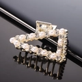 Detail of a gold alloy claw clip with elegant pearls and sparkling rhinestones - Gold Rhinestone & Pearl Triangle Claw Clip
